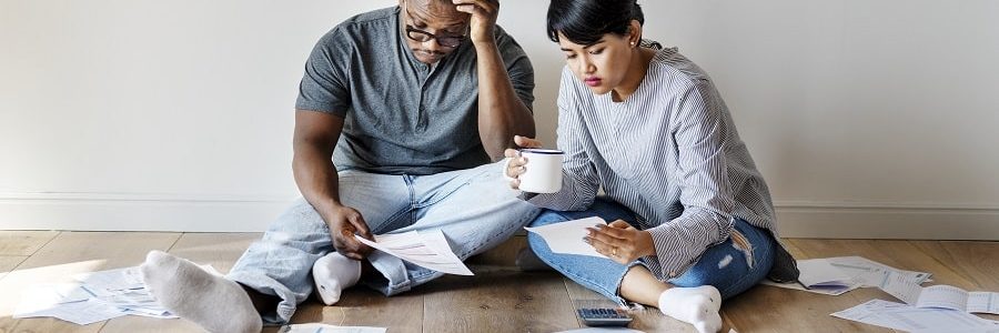 Young Couple Stressing Over Debt - S R & Associates